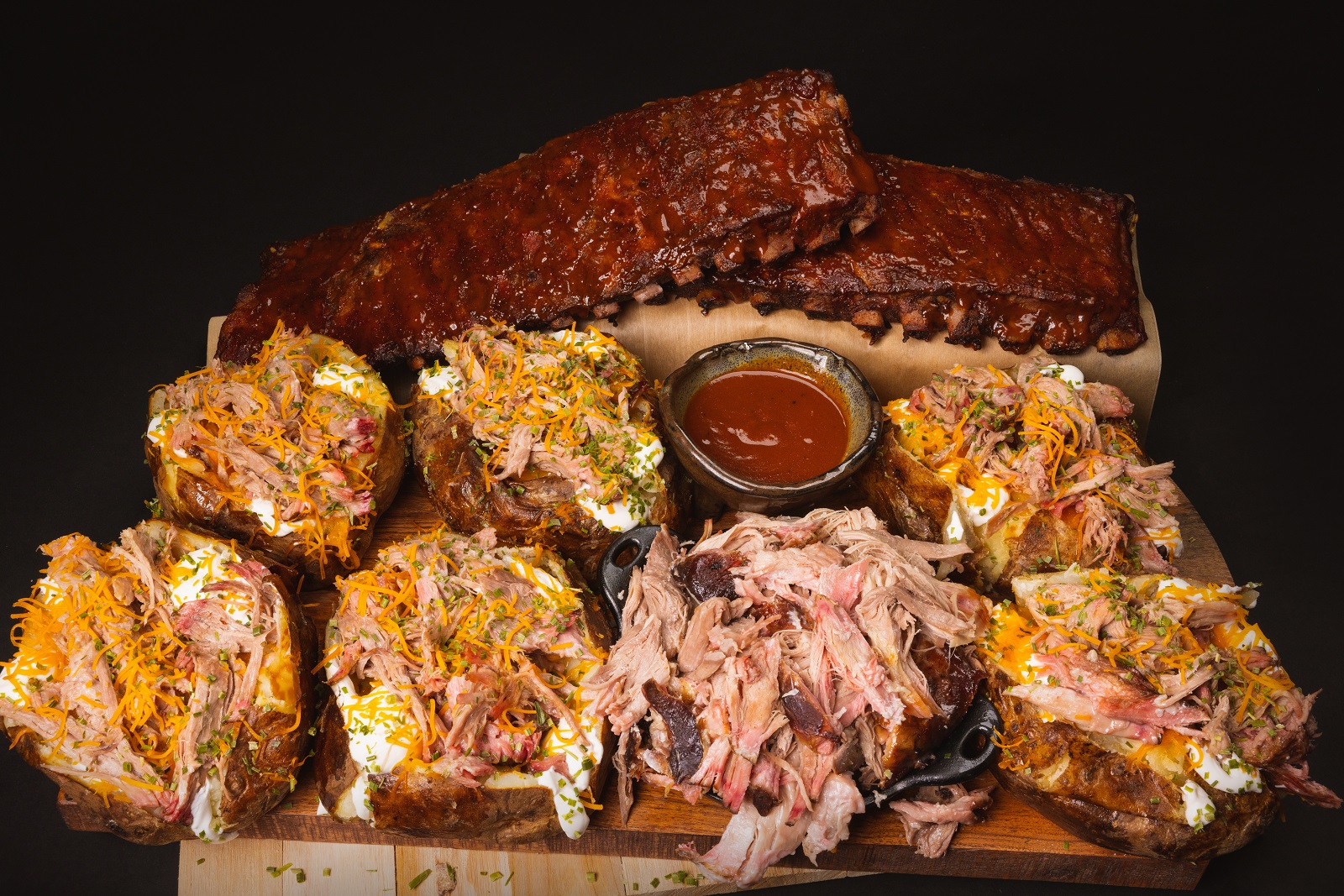 LawLer's Barbecue loaded BBQ baked potatoes and smoked ribs — available for nationwide shipping through Goldbelly to all 50 United States